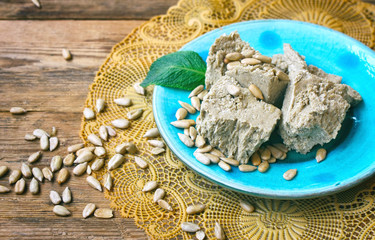 slices halva on turquoise ceramics plate
