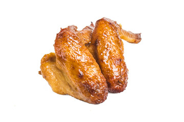 Grilled chicken wings on a white background