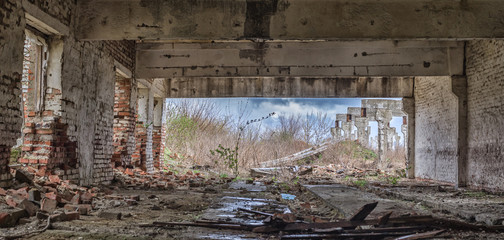 The destroyed building of an abandoned farm on the outskirts of the village, Ukraine.