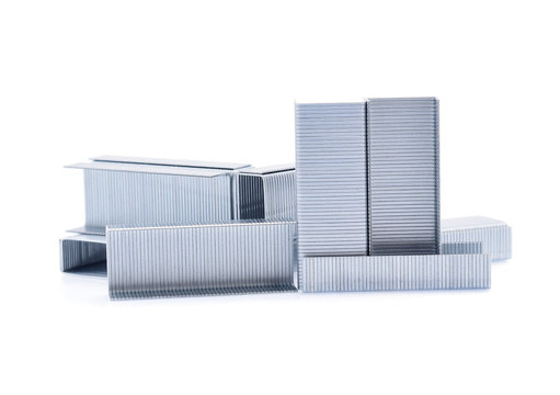 Stack of metal staples isolated on white background.