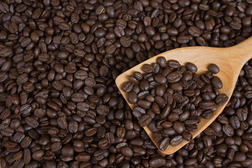 Coffee beans in wood ladle