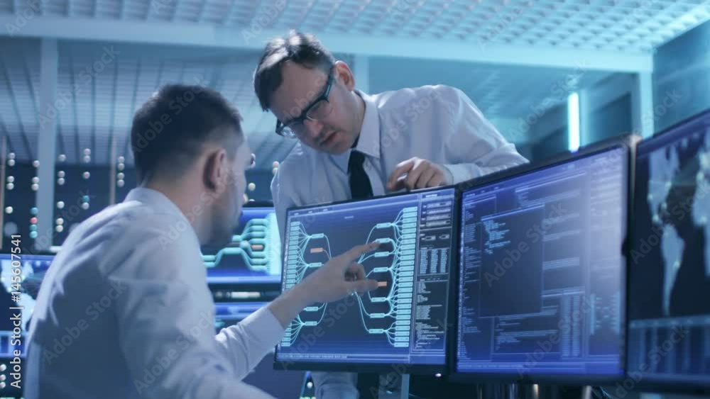 Poster in the system control center technical support team gives instructions with the help of the headsets