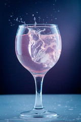 Pure water pouring into a transparent glass