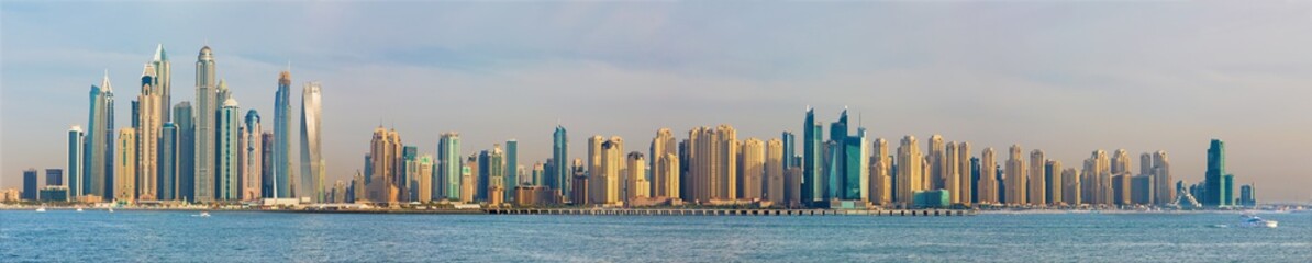 Fototapeta na wymiar Dubai - The evening panorama of Marina towers.