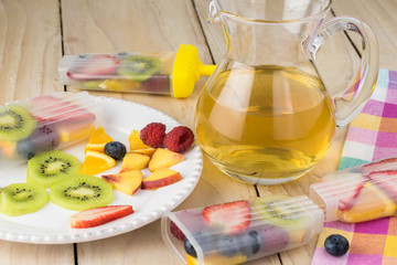 Sliced berries and fruits - ingredients for ice pop.