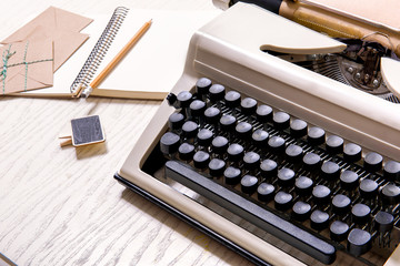 Vintage typewriter at wooden surface