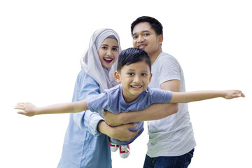 Little boy with his parents in studio
