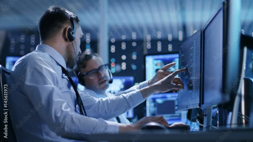Poster In the System Control Center Technical Support Team Gives Instructions with the Help of the Headsets. Possible Air Traffic/ Power Plant/ Security Room Theme.