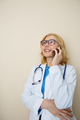 Young doctor talking on phone