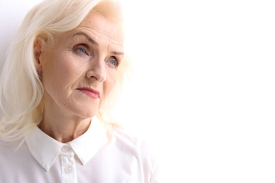 Pensive glance of mature lady