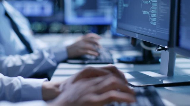 In the System Control Center Team of Technicians Monitor System Stability. Hands Close-up Shot. Possible Air Traffic/ Power Plant/ Security Room Theme. Shot on RED EPIC-W 8K Helium Cinema Camera.