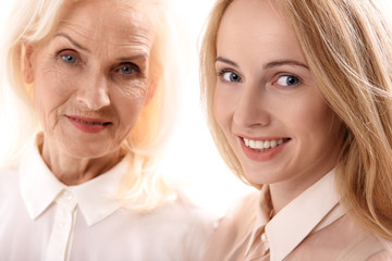 Happy smiling mom and daughter