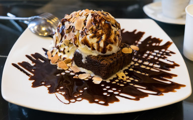 chocolate fudge brownie with vanilla ice cream and whipping cream