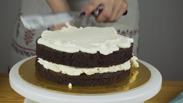 Pouring frosting on Cake. Making Chocolate Layer Cake. Series.