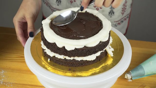 Pouring frosting on Cake. Making Chocolate Layer Cake. Series.