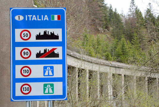 Road sign at the Italian border with indications of the speed li