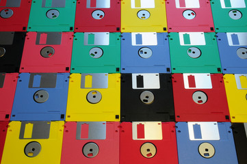 Multicolored floppy disc 3.5 for old computers. Aligned as background.