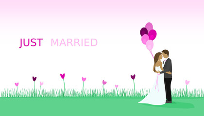 Just married - wedding. Bridal couple in a field full of heart flowers and with balloons.