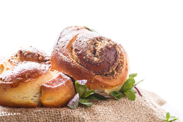 Sweet bun with nut filling in powdered sugar