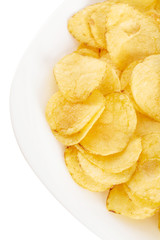 Fototapeta na wymiar Crispy potato chips in plate on white background close-up