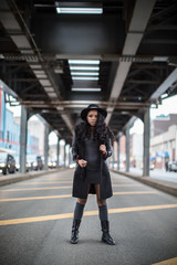 A portrait of a young, attractive, black woman in Brooklyn, New York City. Shot with fashion and lifestyle in mind during the Spring 2017.