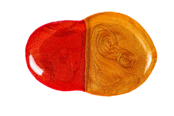 Blot of red and gold nail polish isolated on white background