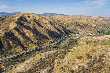 Railroad line in valley of vast California Mojave Desert.