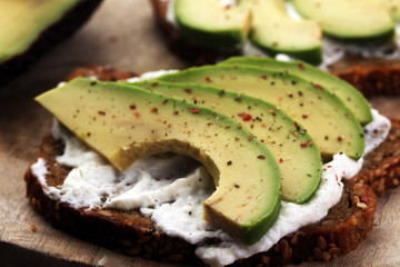 sliced avocado on toast bread with spices and avocado