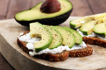 sliced avocado on toast bread with spices and avocado