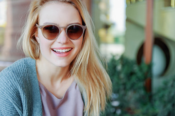 Joyful young woman relaxing outside