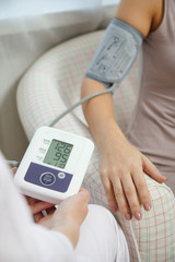 Image of doctor measuring pressure of patient on tonometer