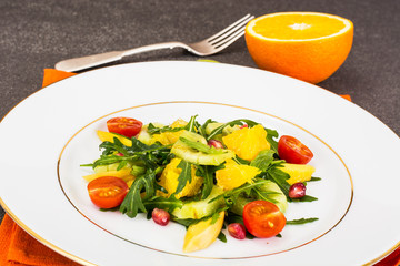 Fruit and vegetable salad with arugula