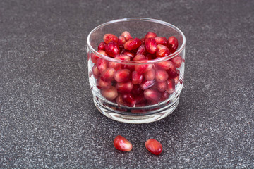 Small glass with dried fruits, nuts, pomegranate