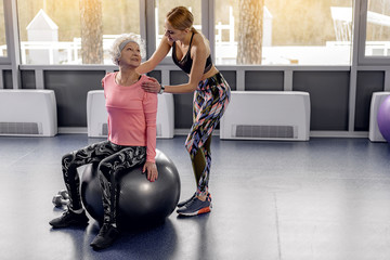 Cheerful granny engaging in pilates