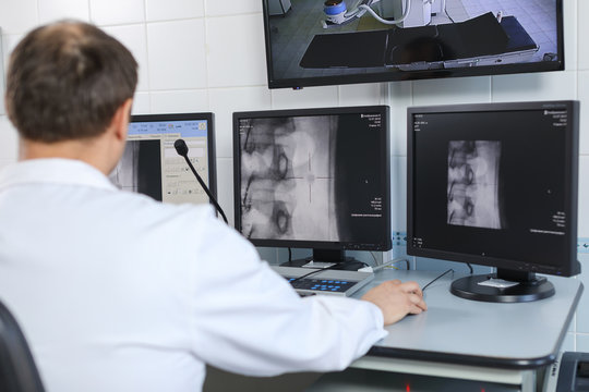 Doctor Looking At The Computer Monitor