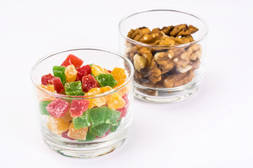 Small glass with dried fruits, nuts, pomegranate