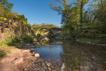 Fototapeta na wymiar Medieval bridge over Miera river in Lierganes, Cantabria, Spain.