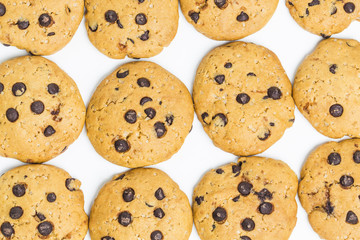 freshly baked chocolate chip cookies on rustic wooden table