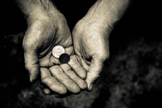 In the hands of man are different metal coins.
