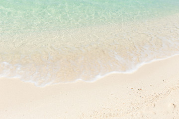 Fototapeta na wymiar white sand blue emerald sea beach for background.