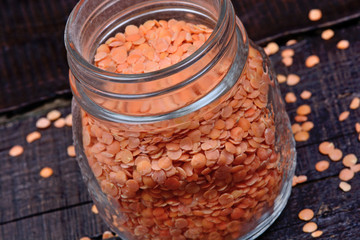 Red lentils in a jar on table
