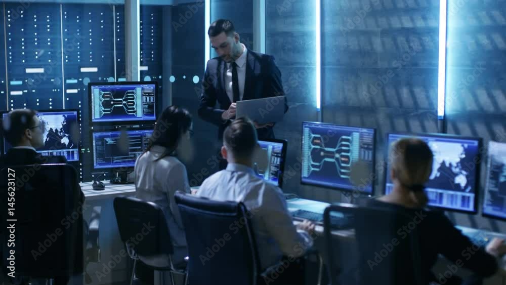 Aufkleber professional it engineers working in system control center full of monitors and servers. supervisor 