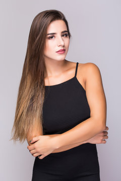 Portrait of beautiful woman in black dress ssolated on white