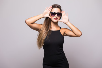 Naklejka premium Portrait of Fashion portrait of young beautiful woman in the black dress on grey
