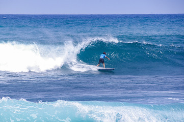 Man surfs on the waves
