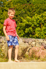 Portrait of boy outdoor in summer time.