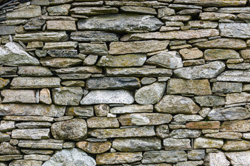 Background wall made of grey stone rocks