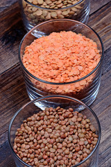 Different types of lentils in a transparent bowls