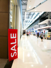 Sale sign in supermarket or shopping center.