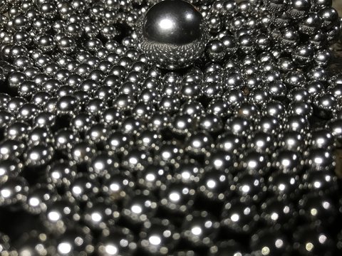 Ball bearings in pile creating reflections © SCJohnG